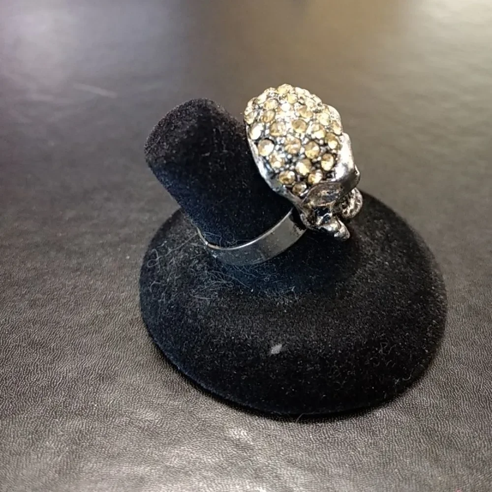 Silver tone and rhinestone skull ring adjustable